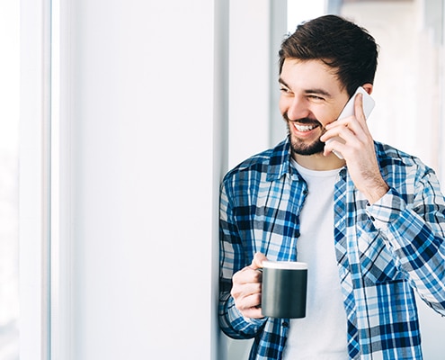 man talking on a mobile phone in the morning